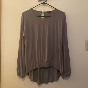 High and low buckle top